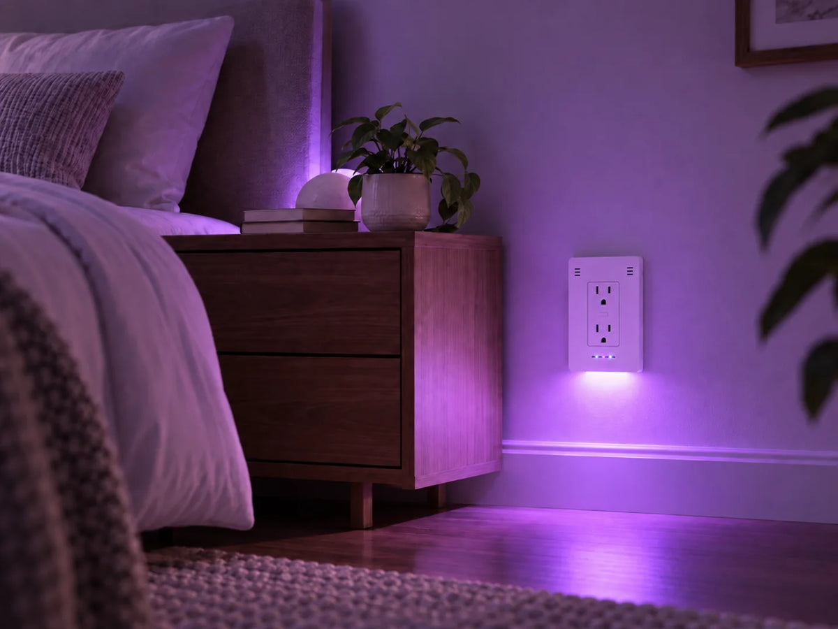 InvisOutlet Aura lighting the same bedroom in violet