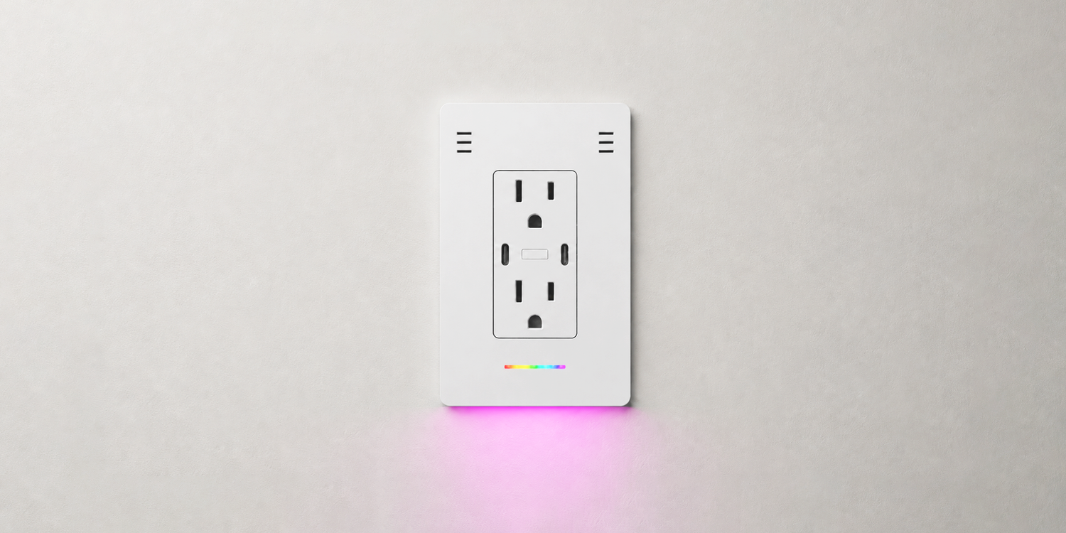 InvisOutlet C Aura installed on a clean white wall with ambient lighting