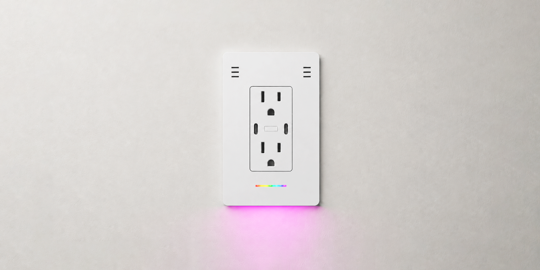 InvisOutlet C Aura installed on a clean white wall with ambient lighting