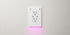 InvisOutlet C Aura installed on a clean white wall with ambient lighting
